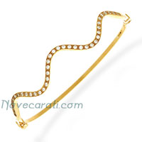 Yellow gold wavy bangle with cubic zirconia