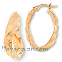 Yellow gold oval hoop earrings with satin finishing and twisted shape